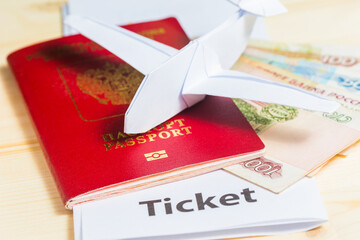A foreign passport with ruble banknotes and an electronic ticket with a paper plane in the style of...