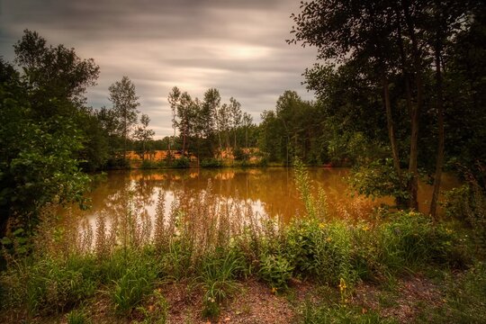 Blatno, Czechia - July 31, 2022: autoportrait by old wooden caravan