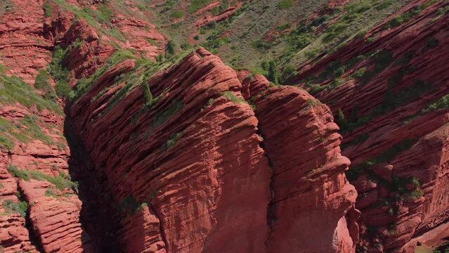 Jeti-Oguz Gorge Issyk Kul Region in Kyrgyzstan. Big red rock formation. Slow shot from drone 4K.