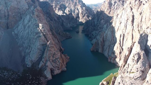 Deep mountain lake. Slow drone movement 4K footage. Lake Kel-Suu is one of the most beautiful alpine lakes of Kyrgyzstan. 