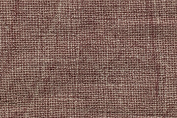 Pink denim fabric. Texture background. Close-up.