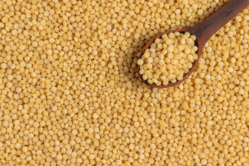 Coarse organic groats couscous. Top view.