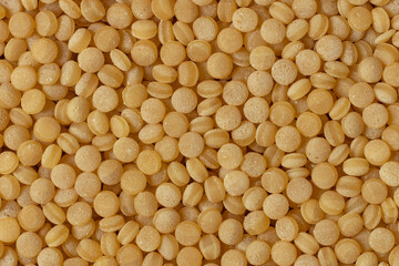 Coarse organic groats couscous. Top view, close-up.