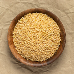 Coarse organic groats couscous. Top view.