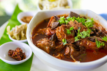 Thai rice noodles with (northern) Lanna curry called nam ngio. Thai food