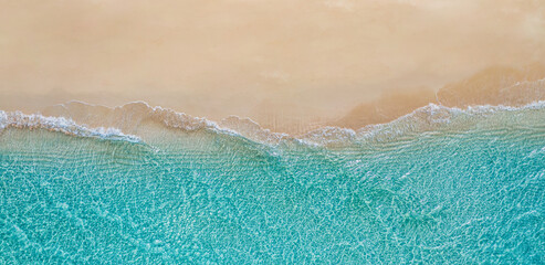 Summer panorama seascape landscape waves, blue sea water sunny day. Top view from drone. Sea aerial view, amazing tropical nature background. Beautiful Mediterranean waves surf splashing panorama