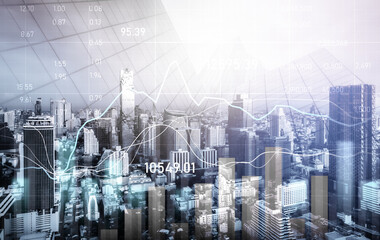 Financial graphs and digital indicators overlap with modernistic urban area, skyscrabber for stock market business concept. Double exposure.