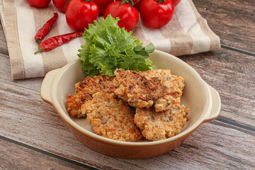 Fried salmonn cutlet in the bowl
