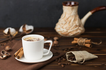 a cup of coffee on wooden table 