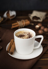 a cup of coffee on wooden table 