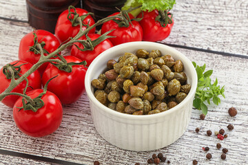 Marinated green capers in the bowl