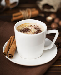 a cup of coffee on wooden table 