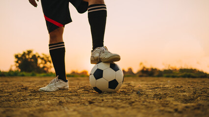 action sport outdoors of a football player having fun playing soccer for exercise at the green...