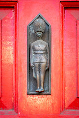 Iron Palace Guard on red door