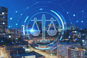 Illuminated aerial cityscape of Seattle, downtown at night time, Washington, USA. Glowing hologram legal icons. The concept of law, order, regulations and digital justice