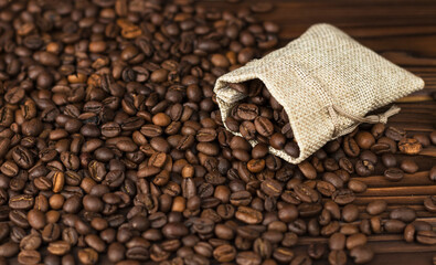 coffee beans from linen bag  on wooden table