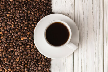 a cup of coffee on wooden table 