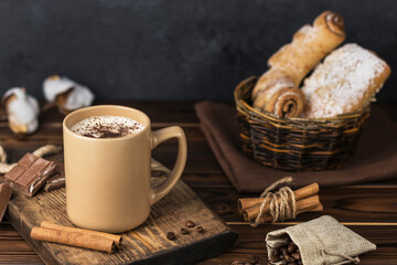 a cup of coffee on wooden table 