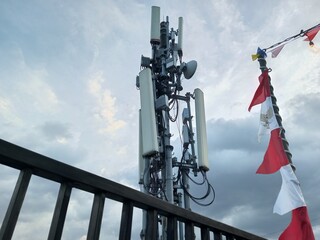 a very high 4g network transmitter seen from an office rooftop