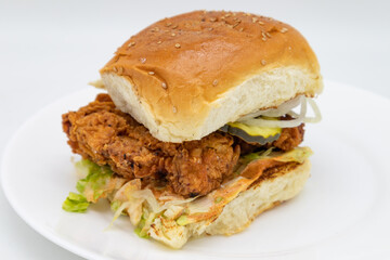 Delicious Buttermilk Fried Chicken Sandwich with Lettuce Pickles and Onions