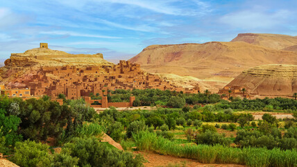 Beautiful central atlas mountains landscape, green oasis, historic maroccan fortified clay village...