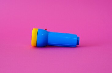 Flashlight on a bright pink background