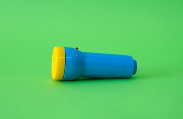 Flashlight on a bright green background