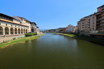 Fototapeta na wymiar Scenic view looking towards Ponte Alle Grazie on a Sunny Day. Florence. Italy.