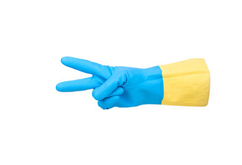 Rubber glove in yellow-blue color under the flag of Ukraine with two fingers showing victory gesture isolated on white background