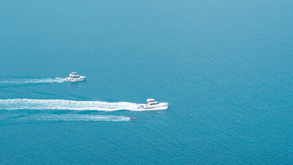 yachts sailing on the sea, top view