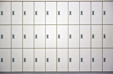  Three rows of white wardrobe boxes with locks