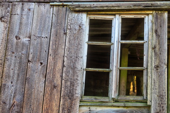 old window in the wooden wall