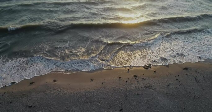 Aerial view flying along Latvian Baltic sea seaside beach coast near Liepaja, Latvia.