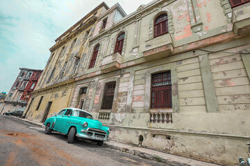 Street scene with old car on rainy day in Havana,Cuba