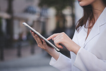Portrait of caucasian businesswoman using tablet pc