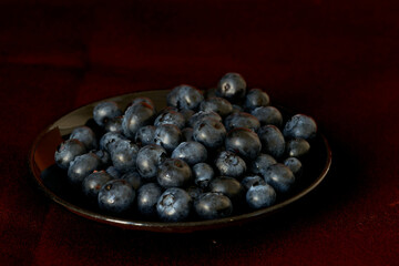 blueberries lie on a black background, harvest