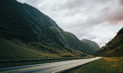 Street leading to nowhere in Norway, summer time. A few hours north from Bergen. Semi wet condition.