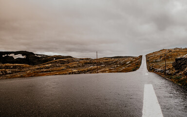 Street leading to nowhere in Norway, summer time. A few hours north from Bergen. Semi wet condition.