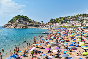 Catalunya,  Tossa de Mar, Spain: 08.14.2022; The summer beach in Tossa de mar