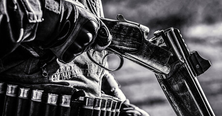 Hunter man. Hunting period, autumn season. Male with a gun. A hunter with a hunting gun and hunting...