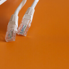 Internet cable on orange background, cable for internet connection