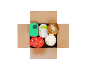 Isolated Carton box with food products, Humanitarian aid for refugees on a transparent background. Food donations and Volunteering and charity for refugees. Flat lay