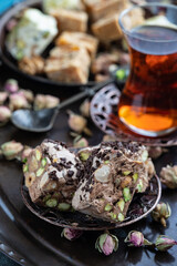 Tea  in glass cups and eastern sweets on copper tray