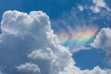 Sundog with white fluffy clouds.