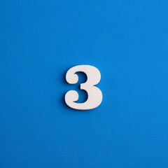 Number 3 in white on blue foami background