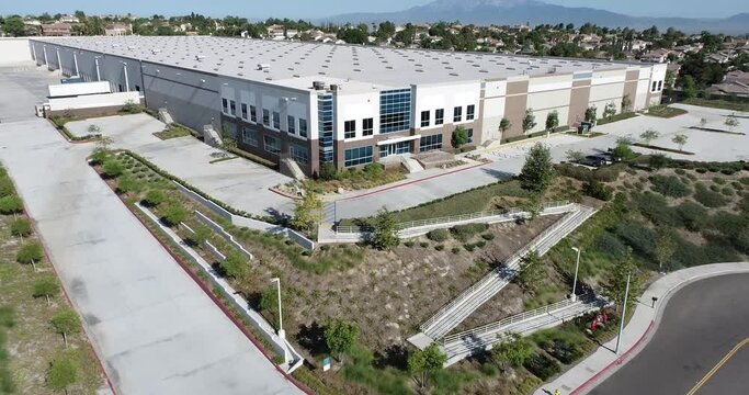 4K Aerial View of New Commercial Industrial Building.
