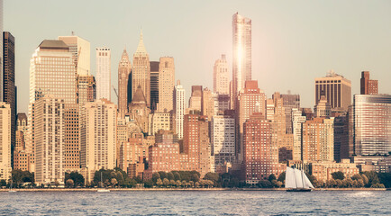 Manhattan waterfront at sunset, retro color toning applied, New York City, USA.