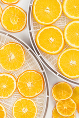 Fototapeta na wymiar orange slices in a tray for preparing dried fruits, background, top view