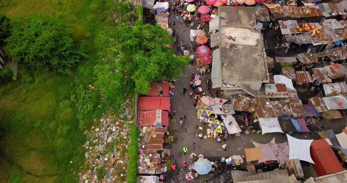 Aerial Forward Tilt Up Shot Of Crowded Market In Residential City - Port-au-Prince, Haiti