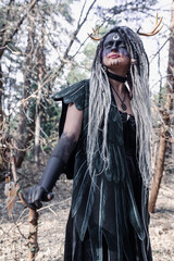 Fototapeta na wymiar Forest witch in a pine forest